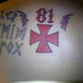 Tattoo 81 closeup shot with maltese cross
