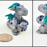 Silver Dragon with a Mini D20 Die