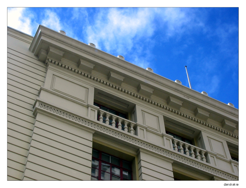 white building vs blue sky