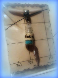 Drink me in blue pendant