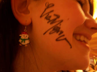 Vic Mignogna signed her face