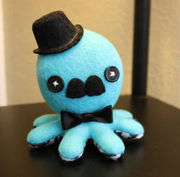 Turquoise and houndstooth octopus plush