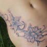 flower and tribal tattoo