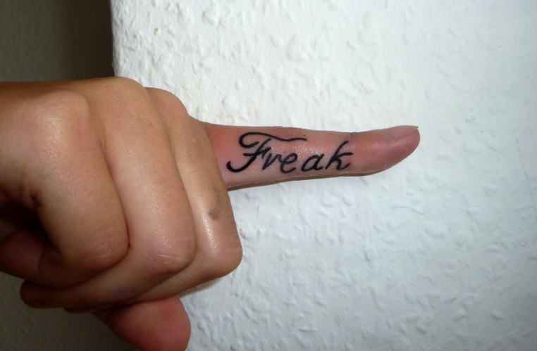 lettering finger tattoo