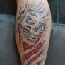 Skull with BMW logo tattoo