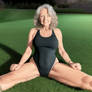 gran on the grass in black swimsuit