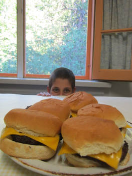 Kid with plate of burgers