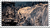 A stamp with a gif of Vicar Amelia from Bloodborne in her beast form, turning around to face the camera.