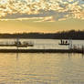Golden Lake Sunset with Boat and Dock Stock