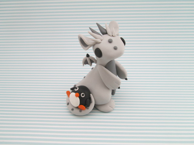 Dragon with a Penguin plush