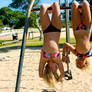 Two Girls Hanging Up Side Down