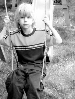 Little brother on swing
