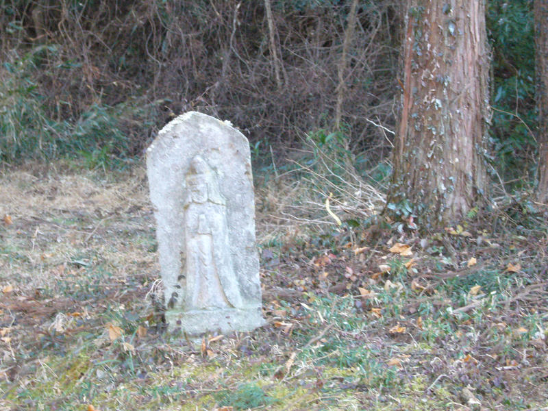 Statue by tree