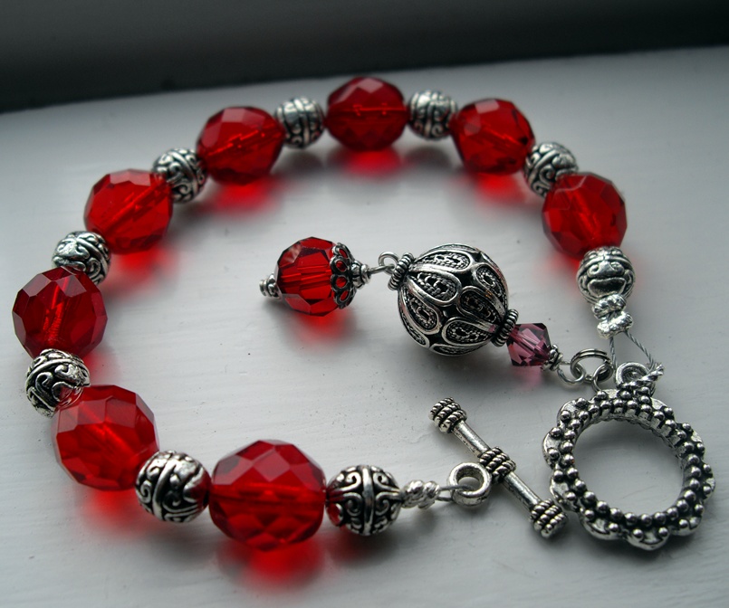 silver and red glass bracelet