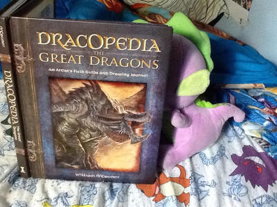 Spike reads my Dracopedia book by AdeanThePurpleDragon on DeviantArt