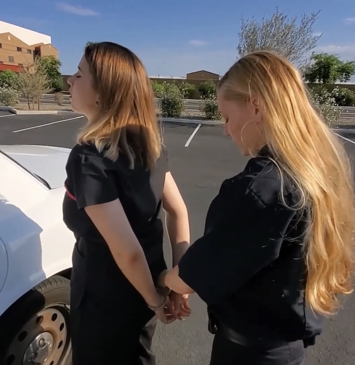 Woman handcuffed against car by female officer by AshnaGopal on DeviantArt