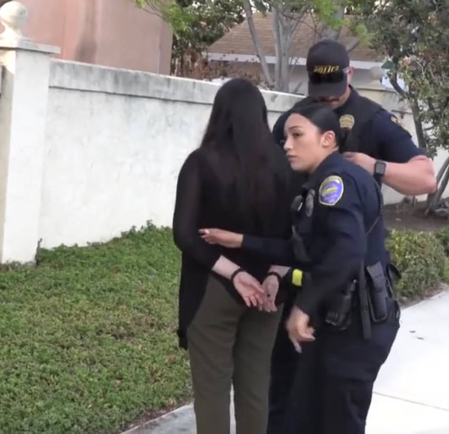 Female cop arresting woman by AshnaGopal on DeviantArt