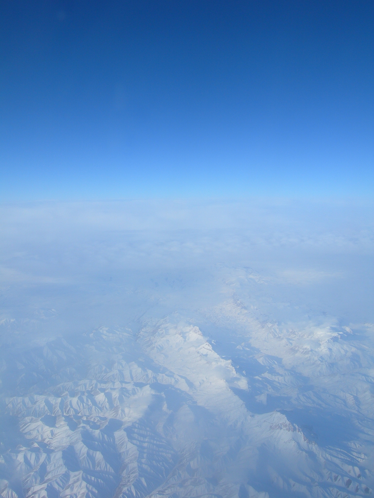 Flying Over Snowy Mountains