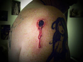 bullet hole tattoo