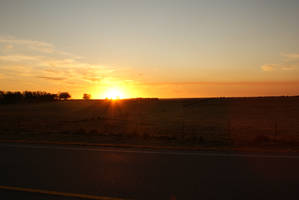 Lovely sunset background image driving dark road