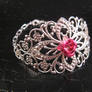 Large pink filigree bracelet