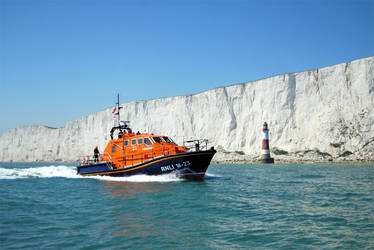 Eastbourne Lifeboat off Beachy Head Lighthouse