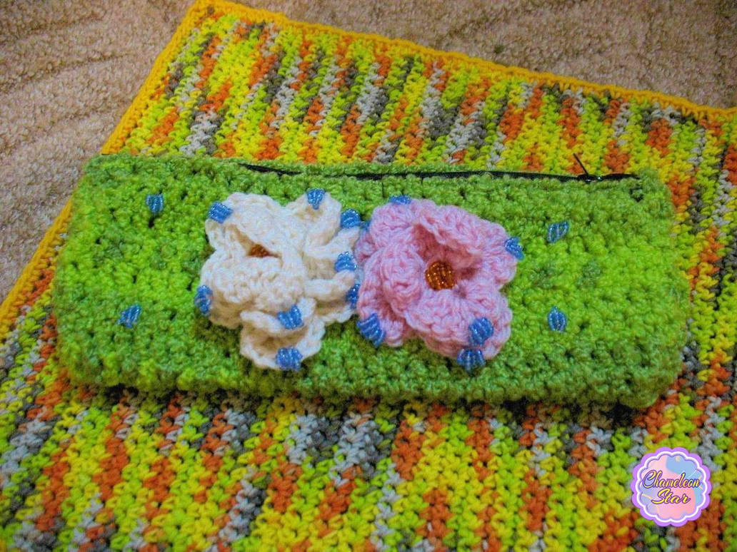 A WIP photo of handmade crochet lime green zipper pouch called Belladonna