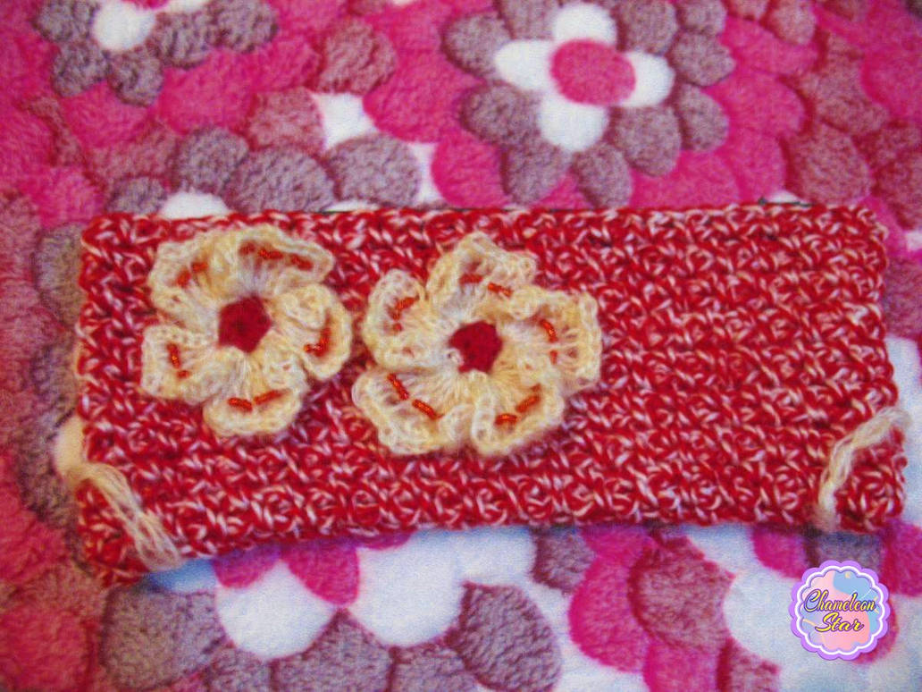 A WIP photo of handmade crochet red zipper pouch called Petra