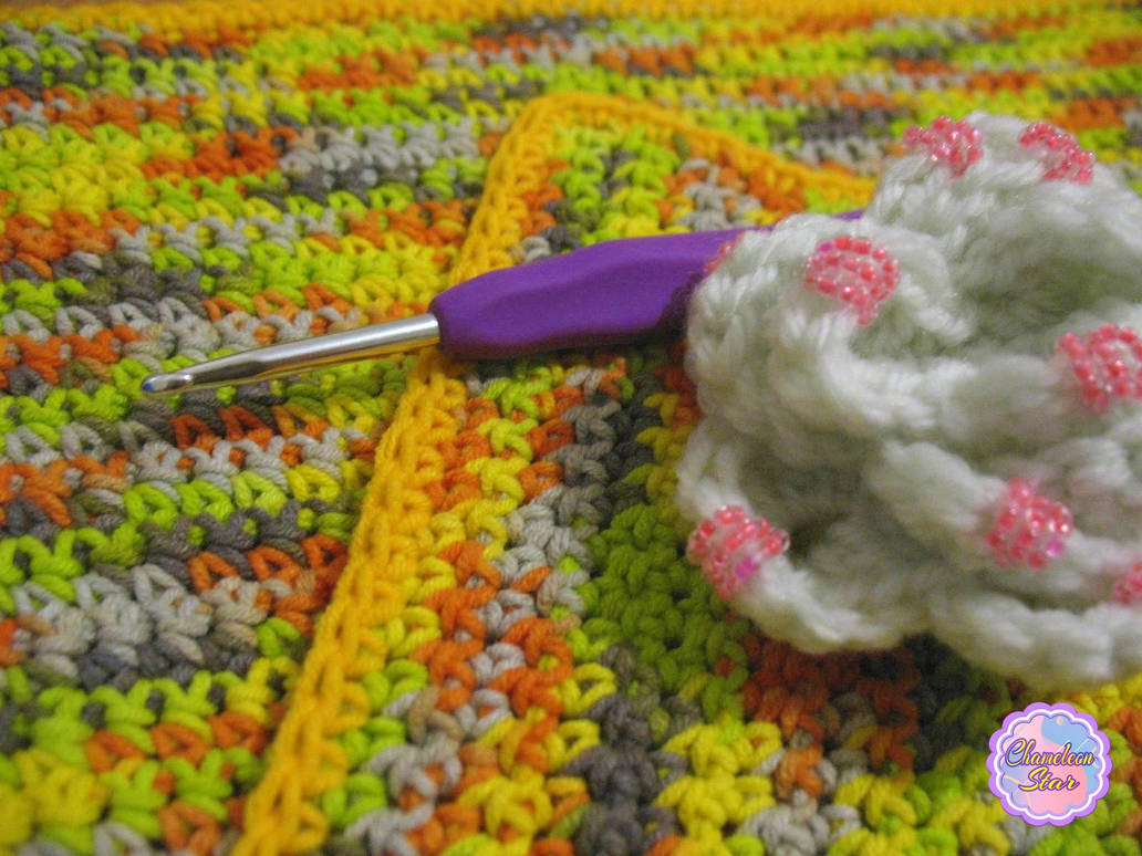 A WIP photo of handmade crochet melange green zipper pouch called Gisela