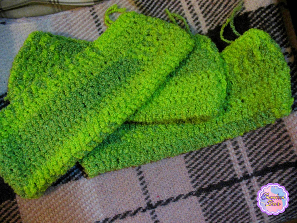 A WIP photo of three handmade crochet pouches' bodies