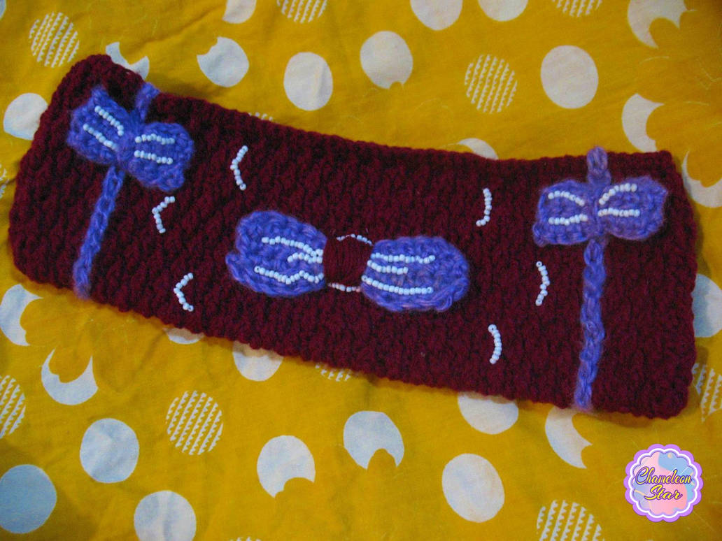 A WIP photo of handmade crochet tyrian purple zipper pouch called Eloise
