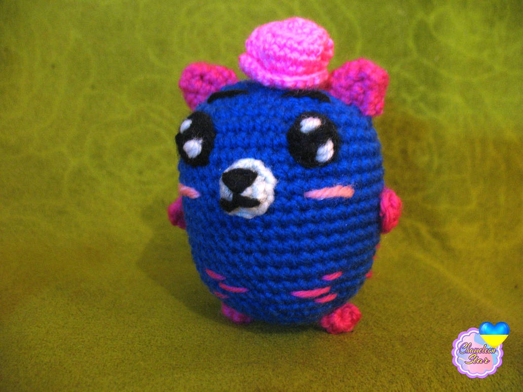 A photo of handmade crochet amigurumi royal blue cat named Makenna, who are a part of a big Tororo Puss family