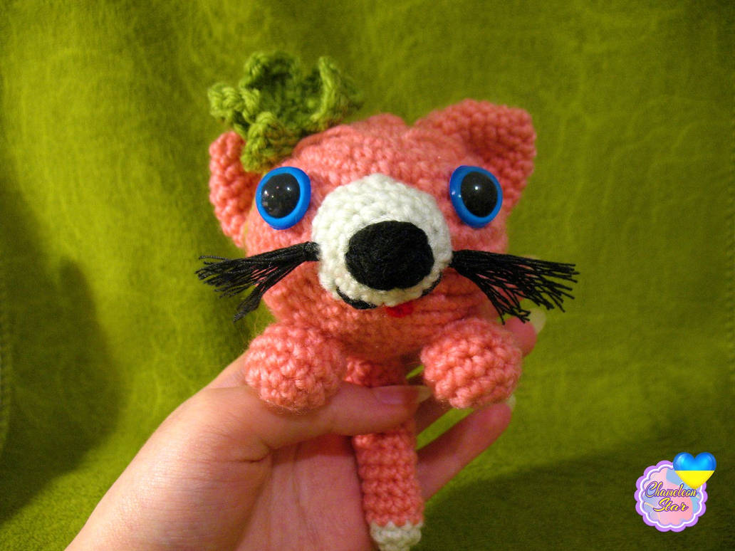 A photo of handmade crochet amigurumi Catsicle in pink color