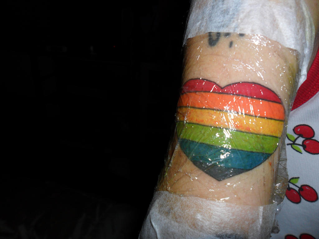 Gay pride heart tattoo.