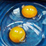 Two Raw Eggs In A Blue Bowl