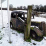 3. Some Snow on a Rusty Vintage Car.