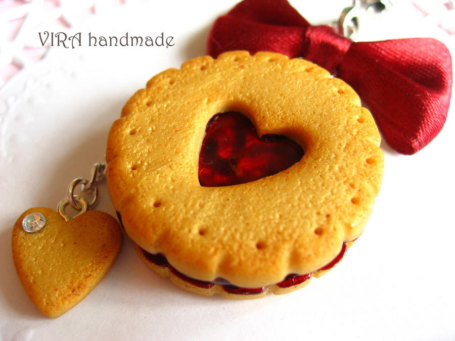 Cute butter cookie with cherry jam