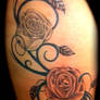 Roses and swirls on thigh