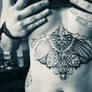 skull wings tattoo