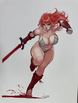 Mindy cosplaying Red Sonja