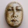 Portrait face on stone