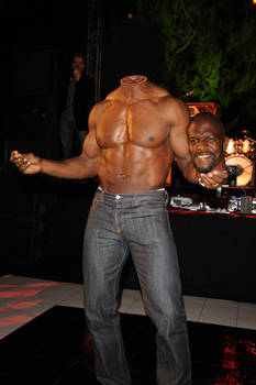 Shirtless man holds his head in the hand