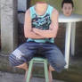 Headless boy sitting near his detached head