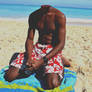 Kneeling on beach towel
