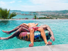 Relaxing on pool float on a sunny day