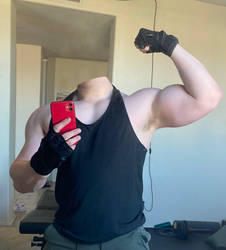 Showing his muscled arm