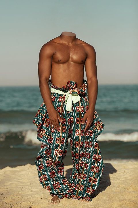 Showing his male torso on the beach