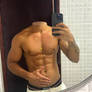 Selfie of headless man showing his six pack abs