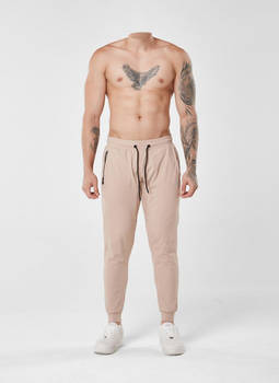 Shirtless man with tattooed pectorals and arms