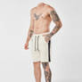 Headless shirtless tattooed man